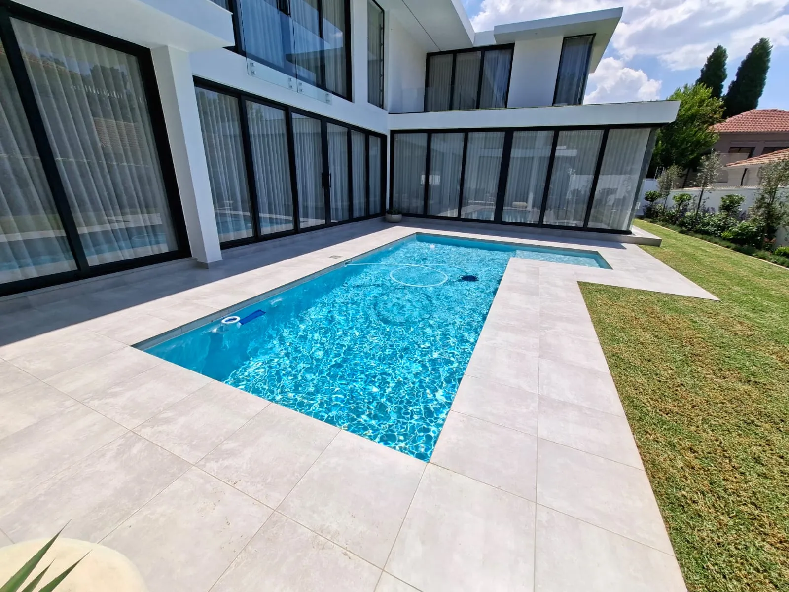 Tropical pool surrounded by palms